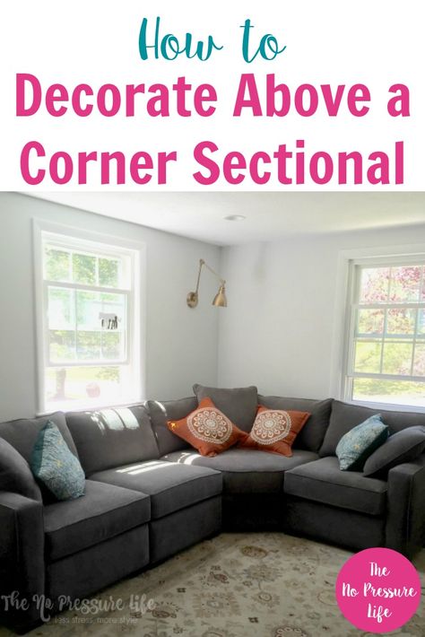 Decorating around corner sectionals can be tricky, so these tips on how to decorate above a corner sectional sofa in your living room are super helpful. Click here to get pretty ideas for wall decor above your couch, plus a free decorating ebook! #livingroom #decoratingtips #homedecor #decorating #decorideas Sectional Sofa In Corner, Behind The Sectional Ideas, How To Decorate Behind A Sectional, Gallery Wall Above Sectional, Corner Sectional Wall Decor, Sectional In Corner Of Living Room, How To Decorate Corners Living Room, Living Room Wall Above Couch, Corner Gallery Wall Living Room