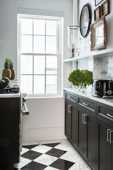 In the kitchen, the designer took inspiration from a previous project to create a custom black-and-white marble floor pattern | archdigest.com Modern Scandinavian Kitchen, Marble Floor Kitchen, Marble Floor Pattern, Checkered Floor, Scandinavian Kitchen Design, White Marble Floor, Black And White Tiles, Black And White Marble, Scandinavian Kitchen