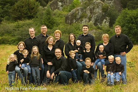 When a family is dress in the same outfit, like this photo family, it is important to give the group different levels that are broken up so that they don't all become a blur of color and faces. The breakups help make this photo better! Large Family Photography, Large Family Portraits, Large Family Poses, Large Group Of People, Family Photo Colors, Big Family Photos, Extended Family Photos, Large Family Photos, Family Portrait Poses