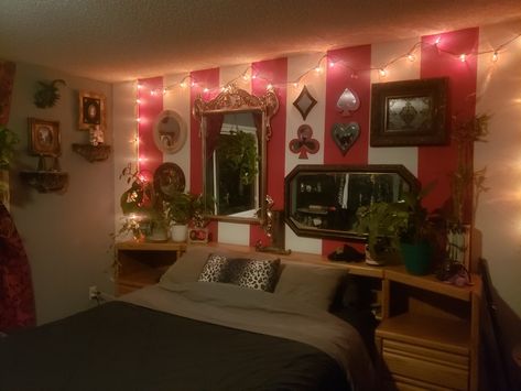 My circus themed bedroom. Blue grey paint on all the walls except 1, done in thick red and white stripes. The wall of mirrors was done entirely with thrift store finds. Clown Bedroom Aesthetic, Clown Themed Room, Circus Room Aesthetic, Circus Home Decor, Roleplay Ideas Bedroom, Circus Theme Room, Clown Bedroom, Burlesque Bedroom, Carnival Bedroom