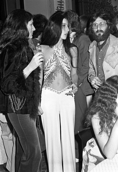 Cher Fashion, Cher Outfits, Beaded Jumpsuit, Cher Photos, Believe Tour, Charlotte Rampling, White Halter Top, Blue Wig, Diana Vreeland