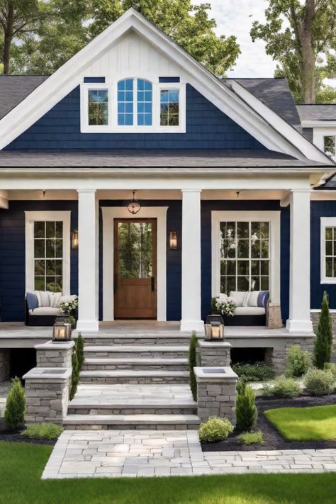 Blue house with white trim, front porch, and landscaped yard. Navy And Cedar House Exterior, House Color Pallet Exterior, White House Exterior Black Trim, Exterior House Colors White Windows, Modern Farmhouse With Color, House Color Palettes Exterior, Dark Blue Home Exterior, Green Houses Exterior, Lake House Exterior Paint Colors