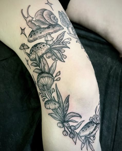 Mushrooms Around Knee Tattoo, Rose And Mushroom Tattoo, Heart Shaped Mushroom Tattoo, Fairy Mushrooms Tattoo, Mushroom Wreath Tattoo, Knee Tattoo Mushroom, Mushroom And Vines Tattoo, Snail With Mushroom Tattoo, Mushroom Fairy Circle Tattoo