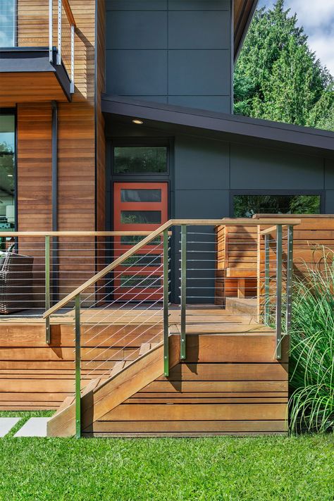 From porches, to decks, this home has a variety of outdoor spaces, covered and uncovered. #decks #customresidentialremodel #homeremodel #frontentry #boardandvellum Platform Deck Front Porch, Wood Over Concrete Porch Front Steps, Front Entry Deck, 1900 Staircase, Stairs To Front Door, Front Deck Ideas Entrance, Front Yard Deck, Front Porch Deck Ideas, Wood Deck Ideas