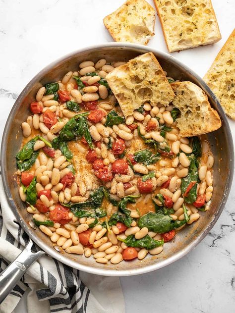 Saucy white beans with spinach is an easy and filling meal made with canned beans that you can throw together on busy weeknight. Tuna White Bean Salad, Tuna White Bean, Cannellini Beans Recipes, Easy Skillet Meals, White Bean Salad, Budget Bytes, Ham And Beans, Ham And Bean Soup, Bean Stew