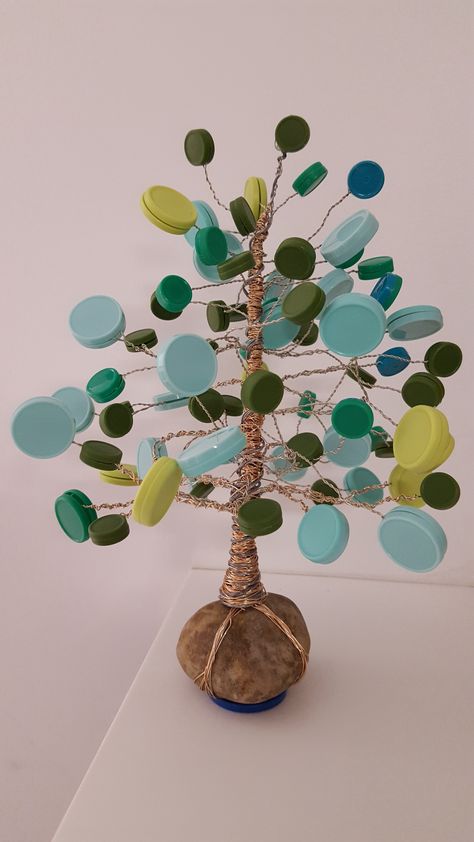 Med cap tree I made for our infusion room :) (made from medication vial caps, hot glue, and wire) Wire Garden Art, Recycled Material Art, Plastic Bottle Caps, Recycled Art Projects, Earth Day Crafts, Bottle Cap Art, Bottle Cap Crafts, Diy Bottle Crafts, Garden Art Sculptures Diy