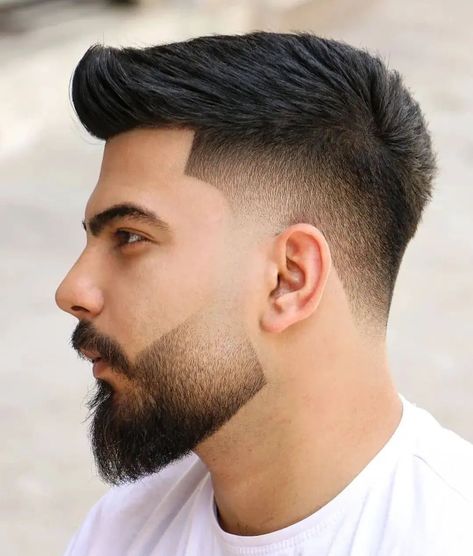 Shadow fades are some of the most stylish haircuts out there. No matter what style you’re wearing, adding this type of fade to the sides and back results in a cleaner, neater appearance, and amps up the cool factor. But what exactly is a shadow fade? It is a haircut characterized by short sides that gradually blend into a longer top. You can style the top however you want, but the transition must be smooth and seamless instead of abrupt. Fades Haircuts, Shadow Fade, Stylish Boy Haircuts, Fade Hairstyle, Gents Hair Style, Beard Fade, Tapered Haircut, Mens Haircuts, Men Haircut Styles