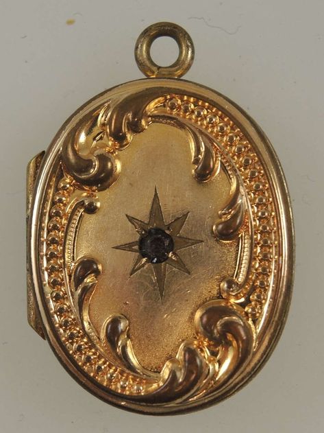 This is an oval locket set with a white stone on the front and also raised scroll work and beading. The back is also decorated with the same raised scroll work and beading. The locket hinges open and inside there is a frame to hold a photo The locket measures 27mm x 18mm x 5mm and is in 95% mint condition - light wear only Old Locket Aesthetic, Edwardian Locket, Edwardian Aesthetic, Vintage Locket, Gold Locket Necklace, Antique Locket, Oval Locket, Scroll Work, Jewelry Lockets