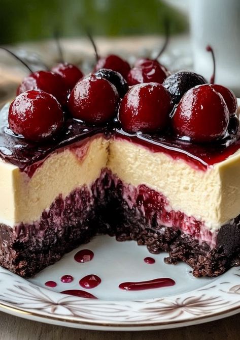 Indulge in this Black Forest Cheesecake: a luscious blend of rich chocolate, juicy cherries, & creamy layers. Perfect for any dessert lover! 🍒🍫 #Cheesecake #DessertGoals #BlackForest #SweetTreat #ChocolateLovers Black Forest Cake With Strawberries, Black Forest Cheesecake Delight, Glazed Cherry Recipes, Cherry Cordial Cheesecake, Cherry Almond Cheesecake, Black Cherry Cheesecake, Chocolate Cherry Cheesecake Recipe, Black Forest Cherry Cheesecake, Chocolate Covered Cherry Cheesecake