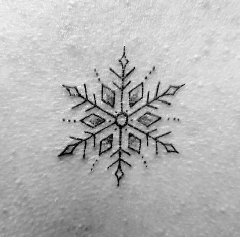 Snowflake back tattoo. #snowflake #tattoo #tattoo #sister #tattoo Snow Tattoo Design, Negative Snowflake Tattoo, Snowflake Stick And Poke, White Ink Snowflake Tattoo, Snowflake Wrist Tattoo, Snowflake Tattoo Placement, Small Snowflake Tattoo Wrist Snow Flake, Snow Related Tattoos, Heart Snowflake Tattoo