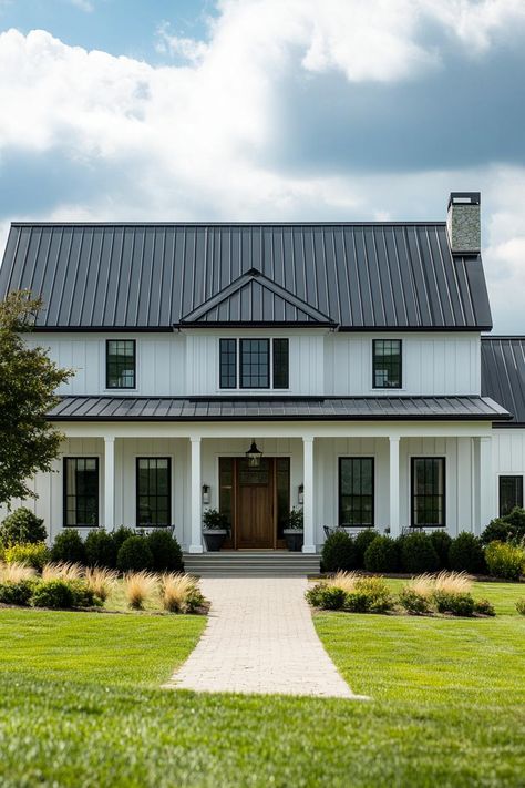 Modern farmhouse with white siding and black roof. Rustic modern farmhouses — where vintage vibes shake hands with modern comfort, sparking interior bliss! Black White And Wood House Exterior, Black And White Ranch House, White Ranch House, Basic Farmhouse, Modern Traditional Farmhouse, Modern Farmhouse Aesthetic, Barndominium Houses, Black And White House, Black Metal Roof