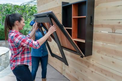 How to Build a Fold-Down Outdoor Bar | HGTV How To Build A Porch, Murphy Bar, Outdoor Deck Decorating, Fold Down Table, Wall Mounted Bar, Porch Swing Bed, Hgtv Shows, Metal Columns, Porch Remodel