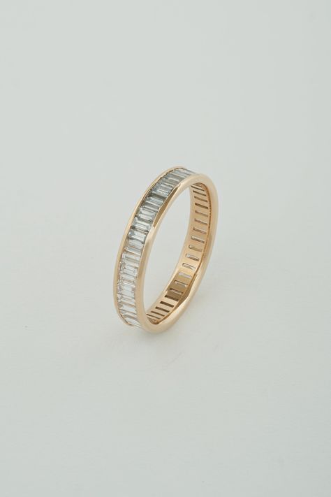 The North South Baguette Band is a channel set band composed of north-south facing white diamond baguettes. The band is eternity style, which means diamonds wrap around the entire exterior of the band. A little deco, a touch modern, this piece is perfect to tie a stack of rings together, compliment a vintage engagement ring, or really stand out on its own. Our Baguette pieces are made with recycled natural diamonds. All diamonds are G-H Color, and VS Clarity. Bands can be matched to a center sto Baguette Band, Baguette Wedding Band, Baguette Diamond Rings, North South, Put A Ring On It, Emerald Engagement Ring, Channel Set, Vintage Engagement, Dream Ring