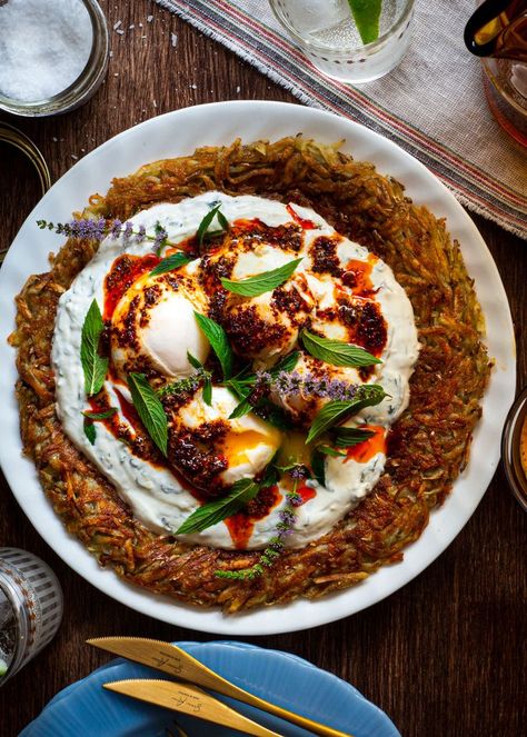 This Çilbir Potato Rösti is a giant potato pancake topped with garlicky yogurt, pillowy poached eggs topped with chili butter and fresh mint. Chili Butter, Potato Pancake, It's Thursday, Potato Latkes, Perfect Brunch, Potato Pancakes, Crispy Potatoes, Fresh Mint Leaves, Crushed Red Pepper Flakes