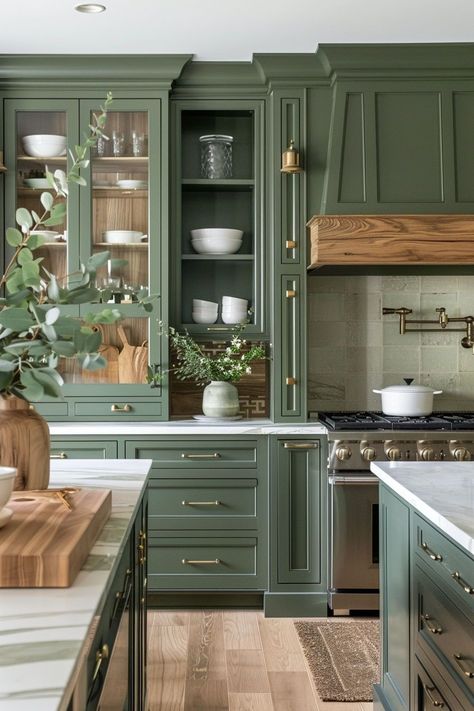 The combination of green cabinets and wood accents in a kitchen is a favorite of mine. The green cabinets bring a sense of nature and tranquility into the space, creating a calming and refreshing atmosphere. When paired with wood accents, the kitchen exudes warmth and a timeless appeal. Wood Top Cabinet, Butcher Block Island Green Cabinets, Kitchen Design Green And White, Mix Of Wood And Painted Kitchen Cabinets, White Oak And Green Kitchen Cabinets, Green Cabinets Quartz Countertops, Green And Copper Kitchen Ideas, Retreat Green Kitchen Cabinets, Painting The Inside Of Kitchen Cabinets