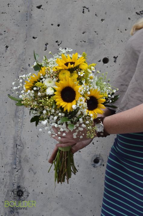 Bridal Bouquet with mini black eyed sunflowers, white pom pom mums, babies breath, queen anne's lace, feverfew, and yellow button pom pom mums. -Boulder Blooms Black And White Sunflower Wedding, Sunflower And Baby Breath Bouquet, Black White And Yellow Wedding, Simple Sunflower Bouquet, Mini Sunflower Bouquet, Flower Bouquet Sunflower, Mum Bouquet, Bouquet Sunflower, Sunflower Bridal Bouquet