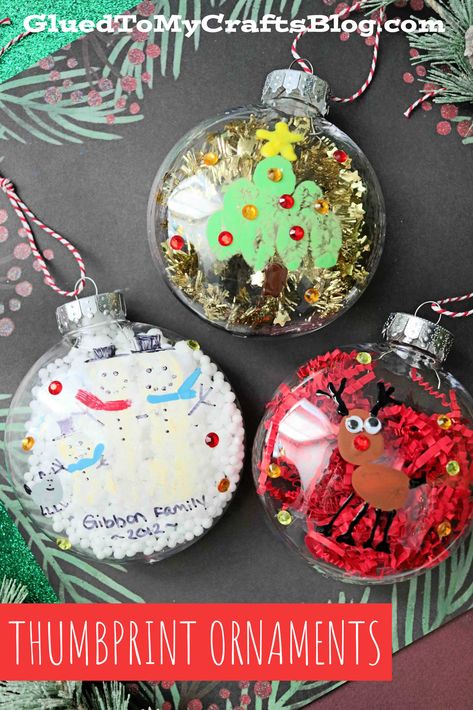 Thumbprint Christmas Ornaments - Kid Craft Christmas Ornament Fingerprint, Ornament Filling Ideas, Christmas Ornaments School, 2nd Grade Christmas Ornament Craft, Kids Christmas Ornaments Crafts, Plastic Ball Ornament Ideas Kids, Preschool Clear Ornament Craft, School Christmas Ornaments Diy, Christmas Ornaments For Preschoolers To Make