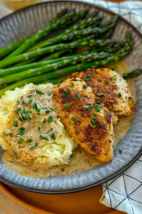 Savor the rich flavor of creamy garlic chicken served with fluffy mashed potatoes and fresh asparagus. Perfect for a cozy dinner! 🍗🧄 #CreamyChicken #ComfortFood #EasyDinners #GarlicLovers #WeeknightMeals Chicken And Asparagus Recipes, Chicken Asparagus Recipe, Mashed Potatoes And Asparagus, Potato And Asparagus Recipe, Chicken With Mashed Potatoes, Potatoes And Asparagus, Potatoes Asparagus, Lemon Chicken With Asparagus, Chicken Mashed Potatoes