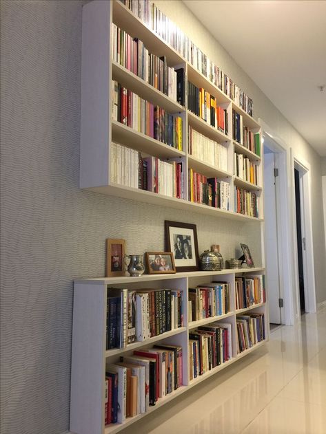 Narrow Hallway Bookshelves, Shallow Book Shelves, Narrow Hallway Bookshelf, Hallway Library Narrow, Book Shelves In Hallway, Hall Bookshelf Ideas, Wall Length Bookshelves, Full Wall Bookshelf Bedroom, Shallow Bookshelf Wall