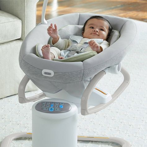 The Graco® Soothe My Way™ Baby Swing with Removable Rocker features 8 soothing motions in 2 directions, for 16 ways to soothe baby. The 2-in-1 design offers a swing seat that doubles as a removable rocker for use throughout the home. Plush fabrics and a removable body support provide added comfort for your little one. The multi-directional seat allows baby to swing facing front, right, or left, for the most soothing options. A 5-point harness keeps baby secure. 6 swinging speeds allow parent to Baby Bouncer Seat, Graco Baby, Baby Gadgets, Baby Swing, Baby Bouncer, Baby Necessities, Baby Swings, Body Support, Figure 8