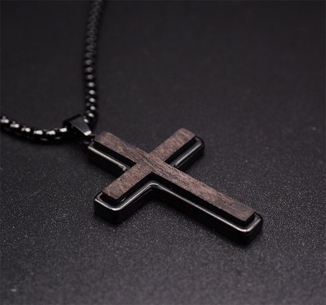 Add a touch of sophistication to your ensemble with our Ebony Wood Cross Necklace for Men. Handmade with care, this black stainless steel Christian pendant features a Real Ebony Wood pendant on a 24-inch chain. It's a symbol of faith and fashion. Highlights: UNUSUAL DESIGN: Wooden Cross Necklace for men using real natural ebony wood with High quality stainless steel. It not only retains the natural essence of the wood cross necklace but also takes into account the strong protection of stainless steel metal. CROSS PENDANT SIZE: Religious necklace/cross, Stainless steel+ebony wood, Polish finish, Pendant size:32mm*48mm, Free 24" box chain GIFT OF FAITH: Great gift choice for special occasions such as a Birthday, Graduation, Anniversary, Wedding, Christmas, Easter, Baptism, Valentine's Day. P Boys Cross Necklace, Wooden Cross Necklace, Cross Necklace Men, Music Designs, Cross Necklace For Men, Christian Cross Necklace, Fashion Highlights, Natural Essence, Cross Jewelry Necklace