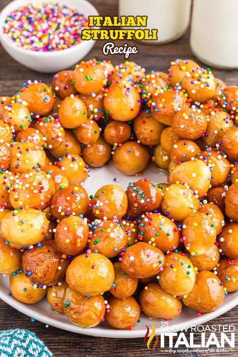 This struffoli recipe is the perfect holiday treat! Make crispy Italian honey balls with fresh oranges, pantry staples, and colorful sprinkles. Italian Christmas Dessert Recipes, Struffoli Recipe, Italian Christmas Desserts, Slow Roasted Italian, Easy Tiramisu Recipe, Italian Cream Cakes, Italian Recipes Dessert, The Slow Roasted Italian, Italian Holiday