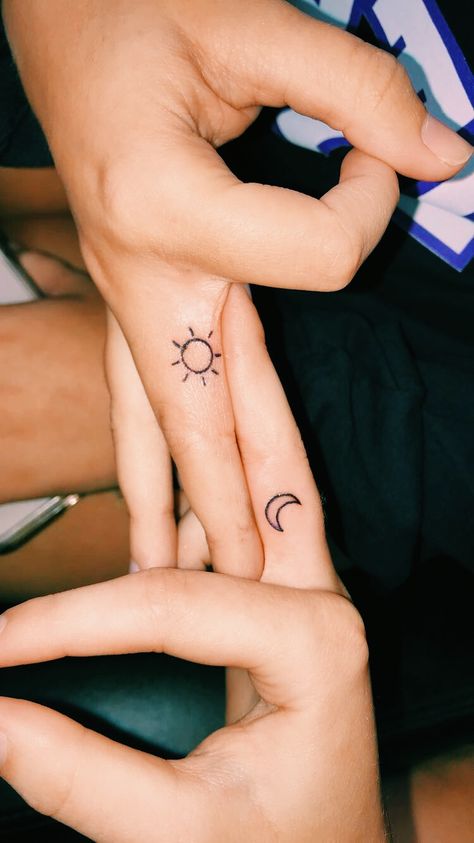 Small Sister Tattoos Sun And Moon, Sun And Moon His And Hers Tattoos, Finger Tattoo Sun And Moon, Sun And Moon Tattoo On Finger, Sun And Moon Finger Tattoo Matching, Bestie Moon Tattoos, Simple Sun And Moon Tattoo Best Friends, Sun And Moon Ring Finger Tattoo, Matching Sister Tattoos Sun And Moon