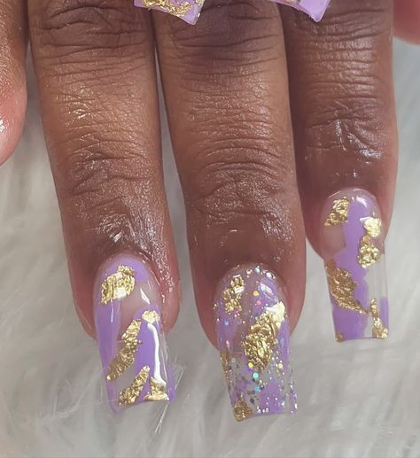 She says shes Royal so she wanted something purple and gold . #purplenails #goldnails #purpleandgold💜💛 #purpleandgoldnails #millenganails #millenga #jenkinscounty #metterga #metterganails #candlercounty #acrylicnails #nails #squarenails #coffinnails #nails #diamondintherough #diamondpressed #godlymade #goddessnails Purple Nails With Gold Flakes, Royal Purple Nails Design, Purple And Yellow Nails Designs, Gold And Purple Nails, Purple Gold Nails, Purple And Gold Nails Designs, Purple And Yellow Nails, Purple And Gold Nails, Light Purple Nails