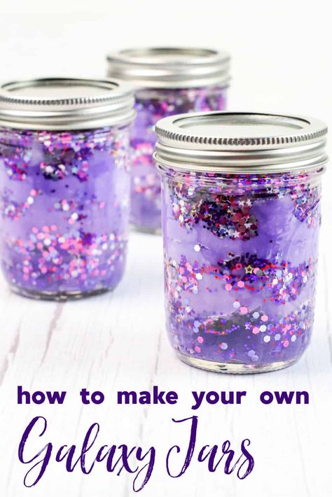 This fun and easy craft is perfect for space fanatics of all ages. With just a few simple supplies, you can create your own DIY galaxy in a jar. These gorgeous sensory jars are the perfect way to relax, calm down, and unwind. Stellar Craft Ideas, Galaxy Jar Craft, Calming Jars Diy, Craft With Jars, Galaxy Crafts For Toddlers, Out Of This World Crafts, Galaxy Jars Diy For Kids Easy, Sensory Jars Diy, Calming Jars For Kids Diy