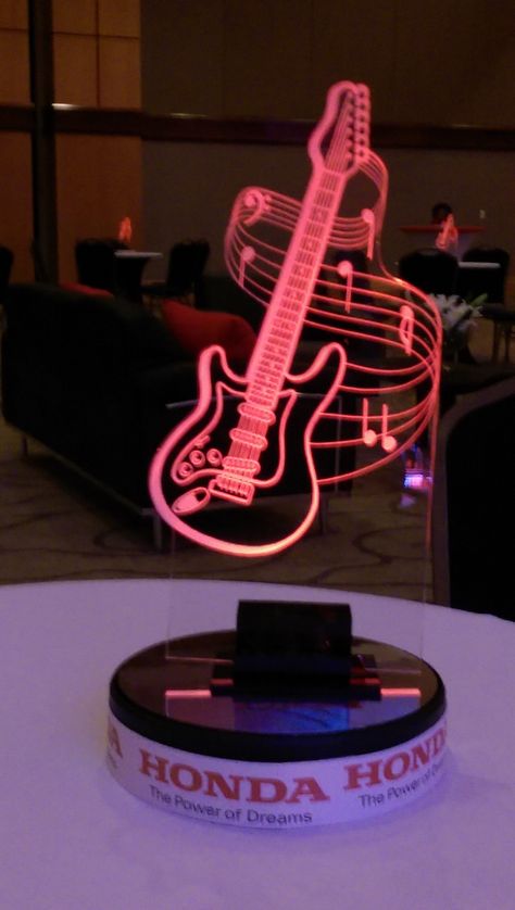 "DO NOT BUY FROM THIS LISTING -- These are EXAMPLES of CUSTOM music pieces we have done for others and price does not correlate to the piece. Price is a ball park of the 16\" Ayden example. We will create stunning illuminated musical centerpieces with ANY instrument or musical notes. We can ALTER the AYDEN Guitar and design your name and date within it. There is an art charge for this since the letters have to be altered into the shape of the guitar. If you are submitting a music/instrument, log Microphone Centerpiece Ideas, Music Theme Party Centerpiece, Music Inspired Table Decor, Music Theme Sweet 16, Music Centerpieces Ideas, Music Themed Centrepieces, Music Note Table Centerpiece, Music Notes Decorations, Music Centerpieces