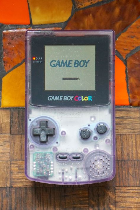 Authentic 1998 clear Atomic Purple Gameboy Color! This Gameboy requires headphones - the sound that comes out of the speaker without headphones is extremely quiet, almost to the point where you can't hear it. With headphones games sound great. Power button and volume control work (volume control works with headphones). There is some weird watermark stains on the screen - see picture 8. I've tried to remove them with no luck. Clear Gameboy, Pretty Alien, 2000s Tech, Gaming Nostalgia, Gameboy Color, Nintendo Gameboy, Mini Craft, Power Button, Great Power