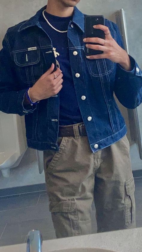 mirror selfie of man wearing dark wash jean jacket with khaki embroidery, brown cargo pants, vintage navy blue shirt with khaki embroidery, pearl necklace and silver rings Denim Jacket With Cargo Pants, Navy Blue Denim Jacket Outfit Men, Navy Denim Jacket Outfit, Dark Blue Denim Jacket Outfit Men, Dark Blue Jean Jacket Outfits, Cargo Pants Denim Jacket, Blue Denim Jacket Outfit Men, Dark Blue Denim Jacket Outfit, Navy Cargo Pants Outfit