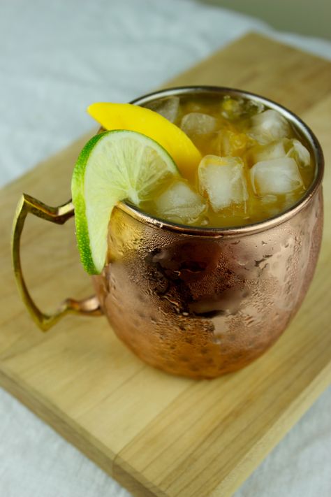 A refreshing vodka summer drink that will be a smash hit at your next party. Mango Moscow Mule, Mango Mule Recipe, Mango Moscow Mule Recipe, Mango Mule, Summer Vodka Drinks, Moscow Mule Drink Recipes, Moscow Mules, Moscow Mule Recipe, Bartender Drinks