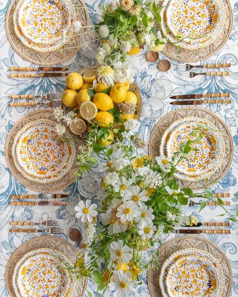 Casa de Perrin on Instagram: "When life gives you lemons 💛🍋💛 Our Fiori Dinnerware in Marigold, a delicate, poetic, and colorful ceramic collection—each plate is a unique creation, entirely handmade under the Italian sun. Paired here with our Iraca Sol Chargers + Sabre Bamboo Flatware + Zoe Glassware + Wooden Salt Cellars, floral by @megan_gray #newcollection #🍽" Lemon Tablescape, Lemon Table Decor, Italian Dinner Party, Sicily Wedding, Italian Party, Italian Theme, Engagement Party Favors, Table Setting Decor, Dinner Decoration