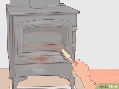 How to Clean a Cast Iron Stove: 10 Steps (with Pictures) - wikiHow Cleaning Rusty Cast Iron, Cast Iron Pot Belly Stove, Restore Cast Iron, Iron Cleaner, Stove Black, Diy Wood Stove, Cast Iron Burner, Pot Belly Stove, Wood Burning Oven