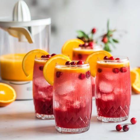 As the days get shorter and the air turns crisp, I'm always on the lookout for drinks that capture the season’s flavors. One of my favorites is the Cranberry Orange Sparkler Mocktail. It’s bright, festive, and Solo Christmas, Orange Mocktail, Winter Sangria, Christmas Mocktails, Easy Mocktails, Cranberry Drinks, Thanksgiving Meals, Thanksgiving Dishes, Festive Drinks