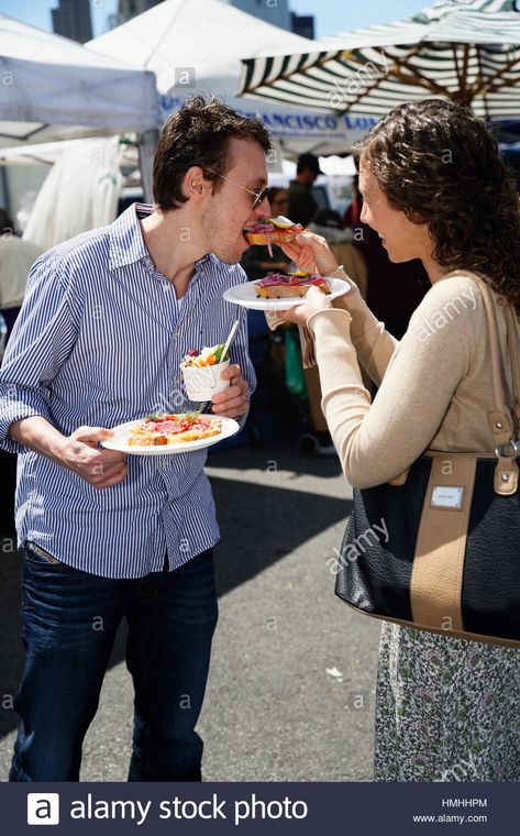 Young Couple Sharing Food at a Street Festival, San Francisco, California Stock Photo Street Food Date Couple, Street Food Date Couple Aesthetic, Couple Sharing Food, Street Food Date, Date Couple Aesthetic, Food Date, Street Festival, Couples Walking, Young Couple