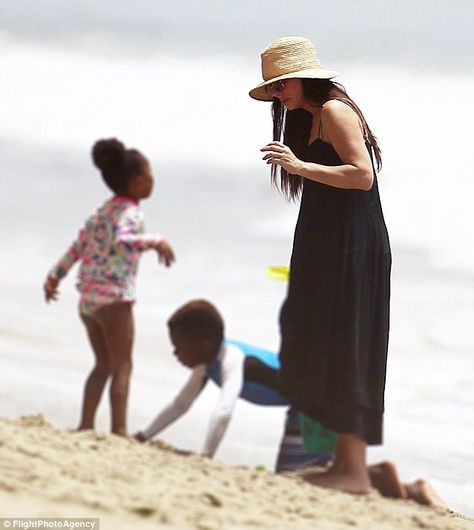 The heat's on: With thermometers in Los Angeles soaring to 98F, concerned mom Sandra Bullock took her children Louis, eight, and Laila, six, to cool off on beach in Malibu on Sunday Sandra Bullock Kids, Sandra Bullock Style, Sandy Bullock, Gravity 2013, The Proposal 2009, Blind Side, Voice Teacher, The Blind Side, Adopted Children