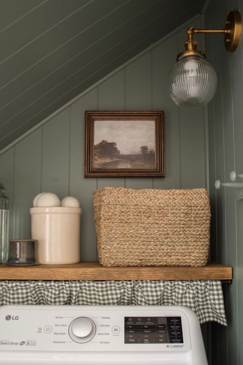 Laundry room transformation from boring and beige to moody and beautiful. Laundry Room Wall Organization Ideas, Shelf Under Cabinet Laundry Room, Colonial Style Laundry Room, Laundry Closet Farmhouse, Folding Table Above Washer And Dryer, Light Yellow Laundry Room, Laundry Room Design Mid Century Modern, Laundry Room Crafts, Laundry Curtain Hide