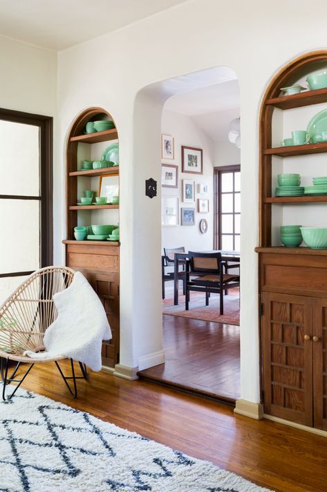 From Historic Built-Ins to an Eye-Catching Arched Doorway, This Remodeled Cottage Is Filled with Charm | Sunset Magazine Arched Wall Built Ins, Historic Built Ins, Arched Windows Interior, Arched Built In Kitchen, Cozy Built Ins, Arch Wall Built In, Archway Built Ins, Built In Shelves Around Doorway, Old House Built Ins