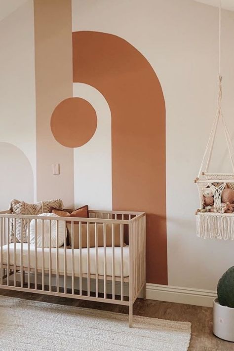 NURSERY WALL IDEAS (12) Easy Nursery Mural Ideas, Painted Arch Over Crib, Abstract Nursery Wall, Baby Nursery Wall Ideas, Nursery Accent Wall Paint Design, Nursery Ideas Wall Paint, Tan Wall Nursery, Painting Nursery Walls, Terracotta Nursery Accent Wall