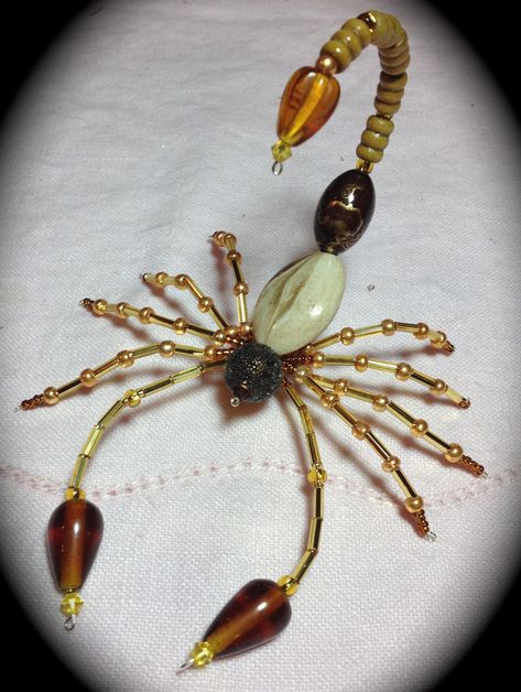 Scorpion made by Andrea Ziebarth Wire Bead Animals, Bead Scorpion, Halloween Jewelry Diy Ideas, Bead Insects, Wire Scorpion, Beaded Scorpion, Wire Bugs, Bead Spiders, Bead Bugs