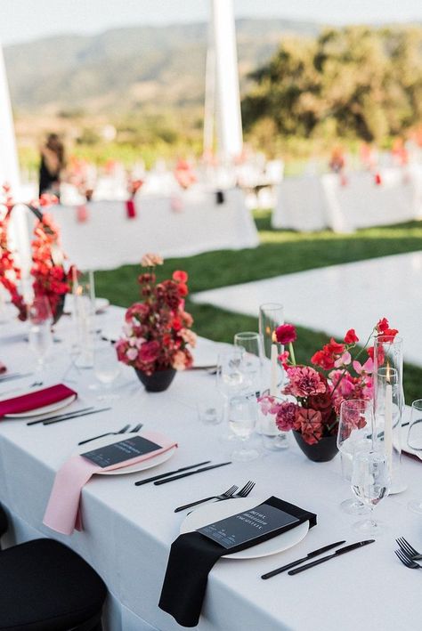 White Table Linens Black Chairs, Black Wedding Bright Flowers, Wedding Florals Table Decor, Black And Colourful Wedding, Red Pink Black And White Wedding, White Table Black Chairs Wedding, Black And White Wedding With Bright Flowers, Black And White With Pop Of Color Wedding, Black And White Wedding Pop Of Color