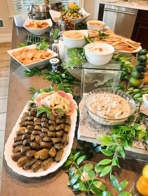 Event station filled with authentic Mediterranean food. Metro-Detroit catering display, Mediterranean cuisine ideas, creative party food for events, grazing table #Mediterranean #Mediterraneanfoos #grapeleaves #Hummus #eventfood #Mediterraneangrazingtable Mediterranean Buffet Table, Mediterranean Cocktail Party, Greek Food Catering, Mediterranean Catering Display, Kardashian Dinner Party, Greek Food Buffet Ideas, Horderves Table Display, Mediterranean Food Table, Mediterranean Bridal Shower Food