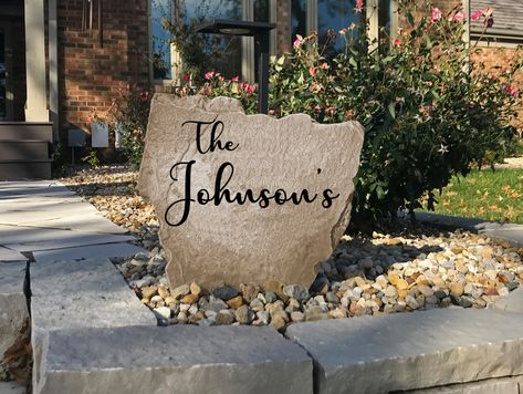 Our Name Rocks add the perfect touch for any homes landscaping! Also a great wedding or housewarming gift!  - Available in Sandstone & Greystone  - Perfect Gift for any occasion - Designed to last a life-time outdoors - Solid Enhanced Concrete – not plastic or resin - Paint that will last – not fade or peel - Design engraved into stone - Simple Installation - Proudly Made in the USA  www.designastone.com Address Stone, Personalized Garden Stones, House Entry, Landscape Rock, Stone Sign, Landscape Stone, Stone Engraving, Resin Design, Home Landscaping