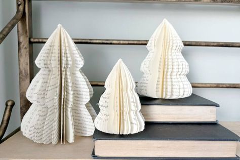 Folded Book Trees Christmas, Christmas Crafts From Old Books, Christmas Crafts With Old Books, Christmas Trees From Books, Christmas Crafts With Hymnal Pages, Book Folding Christmas Tree Tutorial, Repurposing Old Books, Book Themed Ornaments Diy, Crafts Made From Old Books