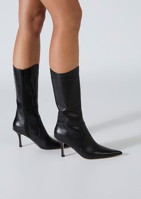 Sheba has a pointed toe and slender heel, creating a sleek silhouette, exuding timeless grace. The distinctive curved opening adds a touch of modernity, making these boots a stand out choice for any occasion. Crafted with precision and style, these calf boots will effortlessly elevate your look. -Material: Leather -Sole: Man-Made -Fit: True to Size -Toe-shape: Point -Features: Curved Opening -Heel: 8cm Leg Height x Calf Circumference x Opening Circumference 5 - 269mm x 318mm x 318mm 5.5 - 273mm Point Toed Boots, Pointed Boots Outfit, Mid Calf Boots Outfit, Calf Boots Outfit, Black Stiletto Boots, Black Boot Heels, Heels Boots Outfit, Pointy Boots, Fall Heels