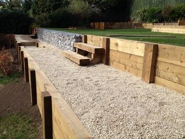 Gabion and Sleeper Walls modern Railway Sleepers Garden, Gabion Wall Design, Sleeper Wall, Sleeper Retaining Wall, Retaining Wall Ideas, Sleepers In Garden, Railway Sleepers, Gabion Wall, Modern Garden Design