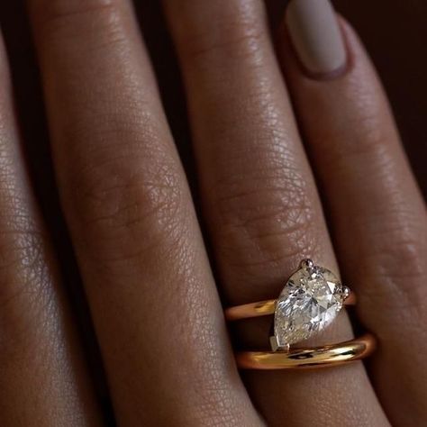 Aristides Fine Jewels on Instagram: "Possibly the prettiest diamond shape... our Tilted Pirum Pear Cut Engagement Ring sitting pretty with Orbit Band." Tilted Pear Engagement Ring, Pear Cut Engagement Ring, Pear Shape Ring, Pear Cut Engagement Rings, Pear Shaped Ring, Pear Engagement Ring, Sitting Pretty, Fine Jewels, Ring Engagement