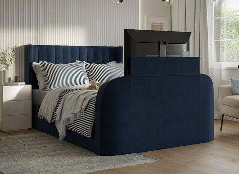 Blend comfort and style with clever TV placement ideas that keep your bedroom both functional and aesthetic. Blue Suede Bed Frame, Navy Headboard Bedroom, Tv In Bedroom Ideas, Tv In The Bedroom, Blue Upholstered Bed, Tv Bed Frame, Navy Bed, Tv Placement, Sofa Bed Blue